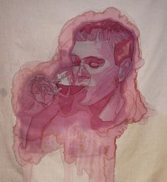 a drawing of a woman's face on a piece of cloth