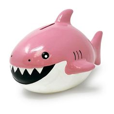 a pink and white toy shark with its mouth open