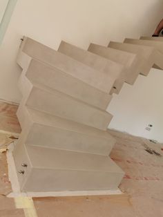 the stairs are being installed in an unfinished room