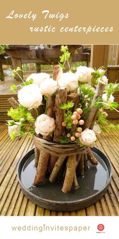 a wooden stand with flowers and branches in it sitting on a wood flooring surface