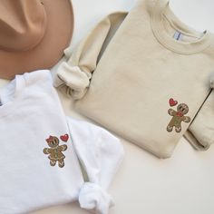 🎄🍪 Step into the holiday spirit with our delightfully sweet Embroidered Matching Couples Christmas Sweatshirt featuring charming Gingerbread people! This season, stand out in the holiday crowd with a uniquely crafted Christmas Sweatshirt, perfect for couples eager to showcase their unity and festive cheer. Choose between a delightful Gingerbread man or Gingerbread woman, or mix and match for the perfect His and Her pairing. Be the envy of every Christmas gathering as a Christmas couple, exuding warmth, style, and holiday affection in your custom-tailored Xmas Couple Sweater. Our Embroidered Sweatshirt is a masterpiece of Custom Embroidery, ensuring every Gingerbread detail is stitched to perfection, bringing the holiday characters to life. The Embroidered Crewneck is designed for comfort Ugly Sweater Couple Ideas, Couples Ugly Sweater Ideas, Matching Sweaters For Couples, Couple Christmas Sweaters, Ugly Sweater Couple, Gingerbread Woman, Couples Christmas Sweaters, Matching Ideas, Matching Christmas Sweaters