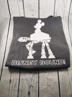 a disney bound bag sitting on top of a wooden floor