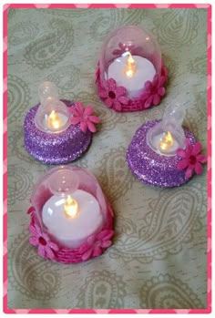 three small candles are sitting on a table