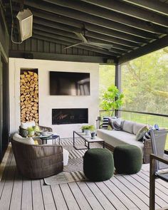 an outdoor living room with wood and furniture