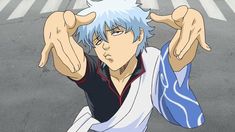 an anime character with white hair and blue eyes holding his hands up in the air