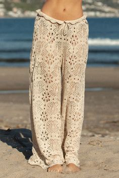 Effortlessly comfortable and breezy for your next getaway, the La Playa Crochet Pants are a must-have for any vacation. With a fun and detailed design, these pants offer comfort and style all in one. Summer Knit Beach Bottoms, Casual Open Knit Beach Bottoms, Spring Beach Open Knit Bottoms, Crochet Pants Beach, Crochet Beach Pants, Crochet Pant, Romper Crochet, Summer Couture, Moda Hippie