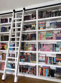 a ladder leaning up against a book shelf filled with books