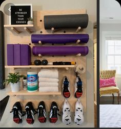 there are many different items on the wall in this room, including shoes and yoga mats