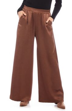 A versatile solid hue brings chic appeal to these flowy wide-leg pants crafted with a comfortable elastic waist. 29" inseam; 29" leg opening; 13" front rise; 16" back rise (size Medium) Pull-on style Front slant pockets 55% polyester, 45% recycled polyester Dry clean Made in the USA of imported fabric Brown Wide Leg Bottoms For Spring, Casual Brown Full Length Wide Leg Pants, Versatile Wide Leg Fall Pants, Ankle-length Solid Color Wide Leg Pants For Fall, Casual Brown Wide Leg Full Length Pants, Brown Straight Pants, Brown Long Pants With Solid Color, Brown Long Pants, Chic Relaxed Fit Wide Leg Pants In Solid Color