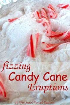 a close up of a cake with candy canes on it and the words fizziing candy cane eruptions