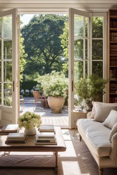 a living room filled with furniture and lots of windows