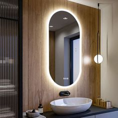 a bathroom with a round mirror above the sink