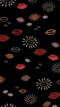 a black background with lots of different colored lips and jewels on the bottom half of it