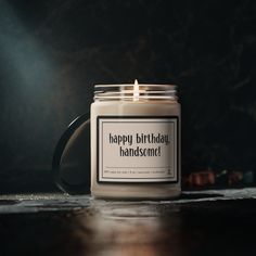 a candle that is sitting on top of a table with the words happy birthday handsome