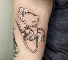 a black and white tattoo of a cat with a bow on it's head