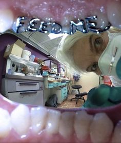 an image of a person in the dentist's office looking at his teeth and mouth