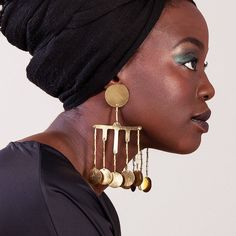 These earrings look like a golden drops. Inspired in the Nubian Queens ornaments. These earrings are perfect for a real statement look. You can wear it with a headwrap to get more bold and sophisticate look. The earrings are made in brass. The brass is cut, hammered and polish by hand . To preserve the gloss, please follow the care instruction you will receive with the packet. Total length: -5,11 inches -13 cm Large statement earrings, Drop African earrings, Bold Afro earrings, Dangle Boho earri Afro Jewelry, Afro Earrings, Nubian Queen, Large Statement Earrings, Round Dangle Earrings, African Earrings, Earrings Teardrop, Bold Earrings, Teardrop Dangle Earrings