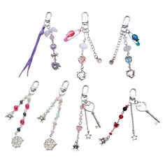 six different key chains with charms attached to them