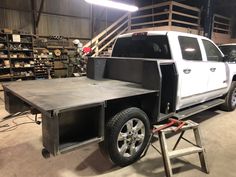 a white truck is parked in a garage