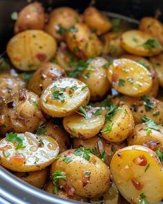 cooked potatoes with herbs in a slow cooker