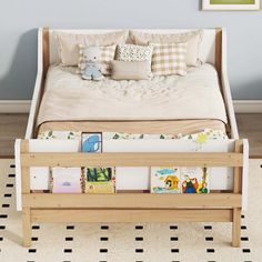 a child's bed with books on the bottom shelf