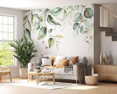 a living room filled with furniture and a painting on the wall next to a stair case