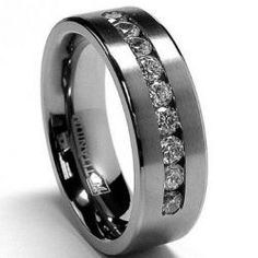 a wedding ring with channeled diamonds on it