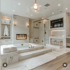 a large bathroom with a tub and shower