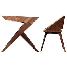 two wooden chairs sitting next to each other