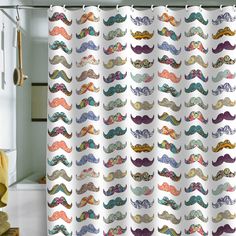 a shower curtain with colorful mustaches on it