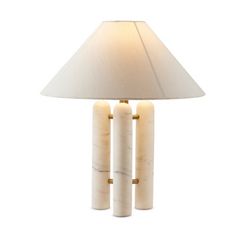 a table lamp with three candles on it and a white shade over the light fixture