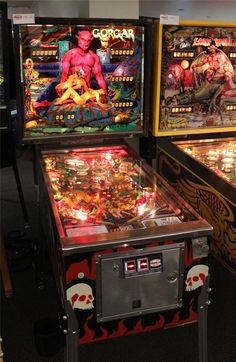 two pinball machines sitting next to each other