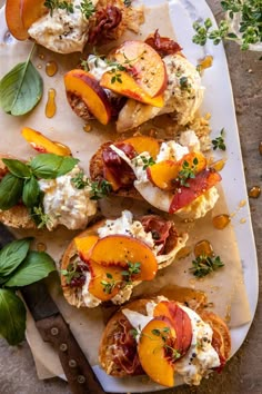 an assortment of appetizers with peaches and cream cheese on a platter