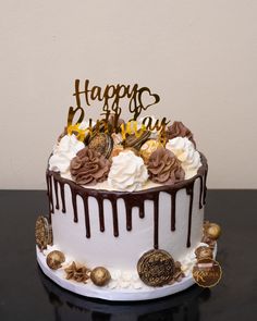 a birthday cake with chocolate and white frosting