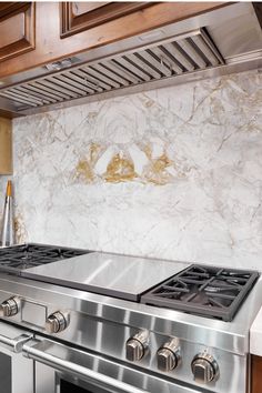 Bookmatched Calacatta Capixaba Marble on Backsplash in Kitchen Unique Tile Patterns, Arizona Tile, Kitchen Marble, Marble Slab, Marble Tile, Tile Installation