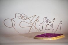 a purple object sitting on top of a white table next to writing that says love