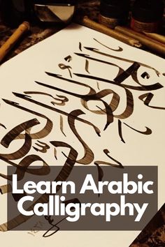 the words learn arabic calligraphy written on paper