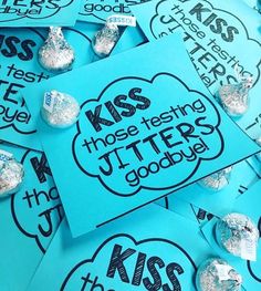 some blue and silver candy wrappers on top of each other with the words kiss those testing