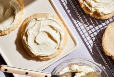 there are some cookies and cream on the cooling rack next to each other with a spoon in it