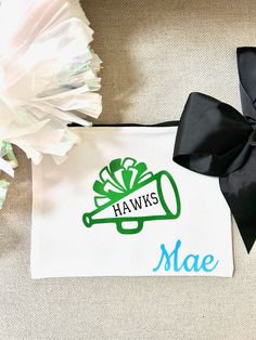 This white canvas pouch is the perfect gift for any cheerleader. It is great to carry cosmetics or anything they may need for practice or a competition. The bag has a zipper and is 9"w x 7"t.  This bag can be personalized with a Name as well as a school/ team/mascot. Don't see a color or font you'd like- let me know via message.  Additional design option listings (as seen in the last photo) can be found here: https://www.etsy.com/shop/TheShoreBride?ref=dashboard-header&section_id=48451842 Cheer emergency kit: https://www.etsy.com/listing/1685019876/cheerleader-emergency-kit-cheer-survival Cheer Makeup Bag, Cheerleader Makeup, Cheer Team Gift, Cheer Makeup, Cheer Team Gifts, Cheerleading Gifts, Dashboard Header, Team Mascots, Cheer Team