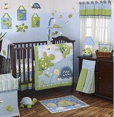 a baby's room with green and blue decor