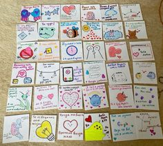 many cards are arranged on the floor with hearts and other things to write in them