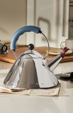 a tea kettle sitting on top of a table