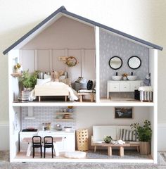 a doll house with furniture and accessories in it