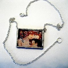 Klimt Mother and Child close up soldered glass pendant on silver plated link necklace The Three Ages Artistic Square Pendant Necklace For Gift, Artistic Rectangular Pendant Necklace As Gift, Artistic Rectangular Pendant Necklace For Gift, Artistic Rectangular Necklace For Gifts, Artistic Rectangular Necklace For Gift, Hand Painted Rectangular Jewelry As Gift, Klimt Mother And Child, Three Ages Of Woman, Klimt Mother