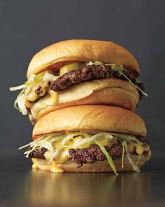 two cheeseburgers stacked on top of each other