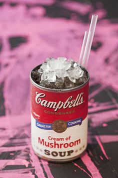 a can of cream of mushroom soup with chopsticks sticking out of the top