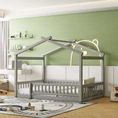 a baby's room with green walls and white furniture