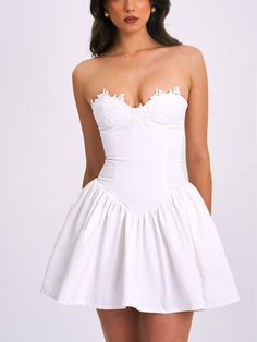 Introducing the stunning Sacha drop waist dress in crisp white, the perfect blend of style and confidence for summer. This chic mini dress boasts a timeless hue that exudes elegance, ensuring you stand out in any crowd. Crafted with a non-slip band for secure wear and functional pockets, you can dance the night away without worry. The delicate lace trim on the top adds a touch of sophistication, enhancing the allure of this eye-catching piece. Whether you're attending a cocktail party or a night Lace Dress With Corset, Puffy Mini Dress, Bridal Mini, Chic Mini Dress, Satin Corset Dress, Waist Corset, Drop Waist Dress, Corset Mini Dress, Bubble Dress