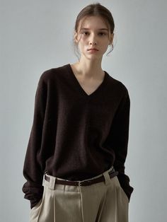 This sweater offers a luxurious and versatile addition to your wardrobe. It is made with cashmere blended fabric with a basic loose silhouette allowing for various stylings.- Suitably deep V-neck design- Excellent insulation and smooth, elegant texture- Suitable for year-round wear, except for summer Dark Chocolate Sweater, Classic V-neck Fall Sweater, Cashmere V-neck Sweater For Work, Brown Cashmere V-neck Sweater, Elegant Cashmere V-neck Sweater For Work, Elegant Fine Knit Cashmere V-neck Sweater, Classic Brown V-neck Sweater For Work, Cashmere V-neck Sweater For Fall, Classic Cashmere V-neck Sweater